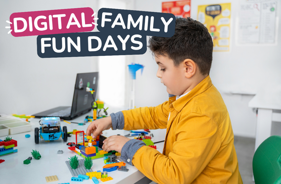Photo of child playing with lego and a computer